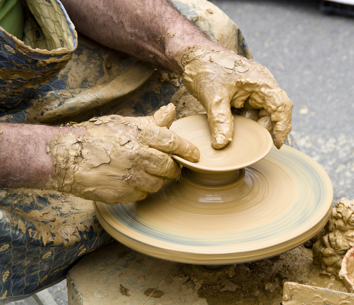 Man Making a Pot Using Clay